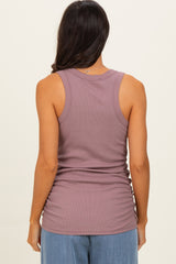 woman wearing a mauve sleeveless tank top with a ribbed texture and gathered side details
