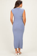 woman wearing a light blue sleeveless ribbed maternity dress with a fitted silhouette, showing off her baby bump from the back