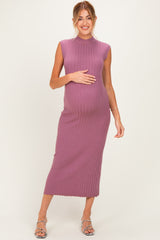 woman wearing a ribbed mauve maternity dress, showing her baby bump, with a knee-length hem and sleeveless design