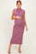woman wearing a ribbed mauve maternity dress, showing her baby bump, with a knee-length hem and sleeveless design