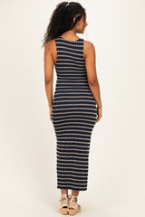 woman wearing a navy and cream striped maternity maxi dress, viewed from the back