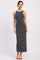 woman wearing a navy blue and cream striped maxi dress with a fitted silhouette and sleeveless design