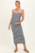 woman wearing a navy and white striped maternity maxi dress with spaghetti straps and a visible baby bump
