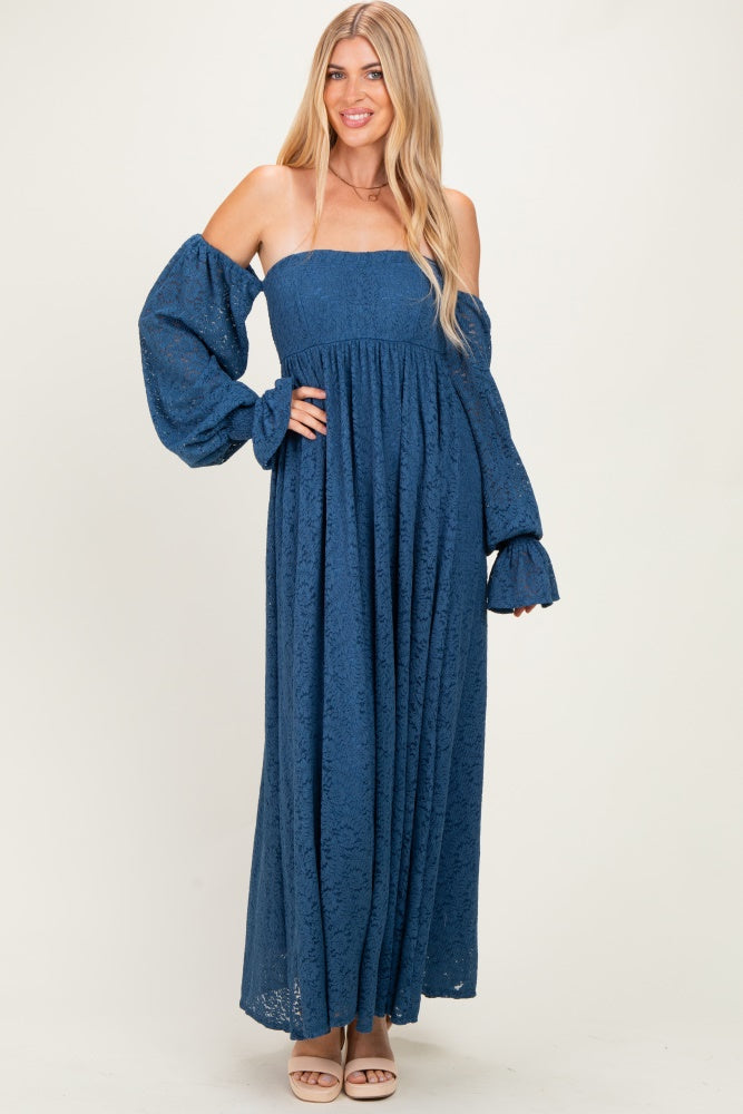 woman wearing a blue lace maxi dress with off-the-shoulder sleeves and voluminous puffed sleeves