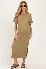 woman wearing a striped maternity maxi dress with a round neckline and side split, styled with sunglasses and sandals
