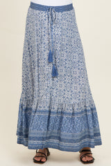 maternity wear maxi skirt in blue with intricate patterns and a tied waistband, model wearing sandals