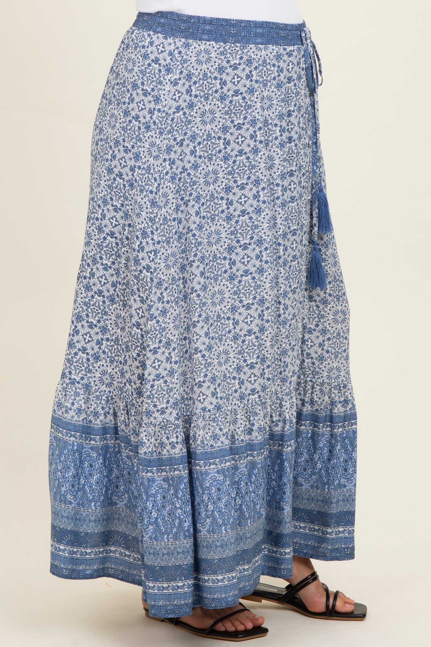 maternity wear blue patterned maxi skirt with a flowy design and tassel details on the waist