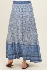 maternity wear blue patterned maxi skirt with a tiered hem, model seen from the back