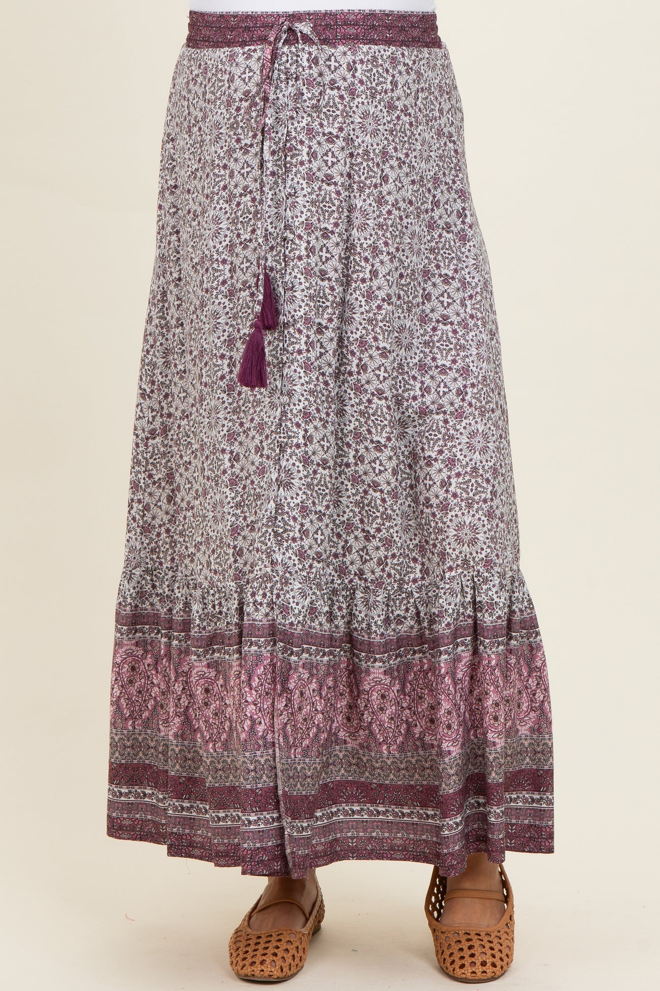 maternity wear long purple and white patterned skirt with a drawstring waist and tassel detail, model not shown