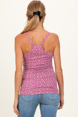 woman wearing a pink patterned maternity tank top with a fitted style and adjustable straps