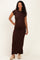 woman wearing a brown short sleeve maternity maxi dress and showing her baby bump
