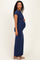 woman wearing a navy blue cap sleeve maxi dress and holding her baby bump