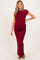 woman wearing a burgundy short sleeve maternity maxi dress, highlighting her baby bump