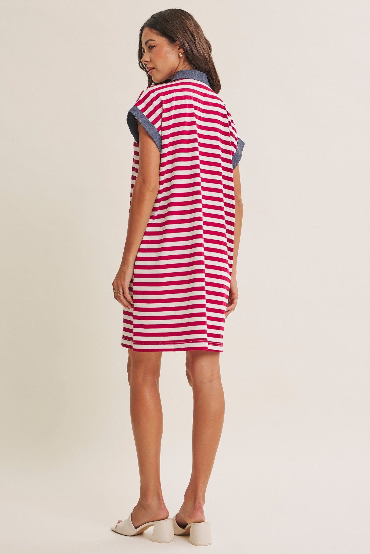 woman wearing a red and white striped short sleeve dress with a denim collar
