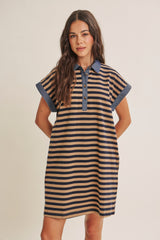 woman wearing a striped polo dress with short sleeves and a denim collar