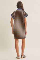 woman wearing a brown and navy striped short sleeve dress with a collar, shown from the back