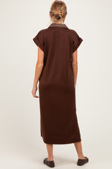 woman wearing a brown maternity dress with short sleeves and a collar, shown from the back
