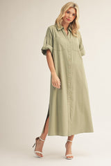 woman wearing an olive green button-up maxi dress with roll-up sleeves and side slits
