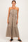woman wearing a taupe strapless maxi dress with a drawstring waist and tiered skirt