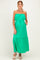 woman wearing a vibrant green strapless maternity maxi dress with an elastic waist and pockets