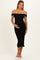 woman wearing a black off-the-shoulder ruched maternity dress and holding her baby bump