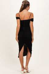 maternity wear black off-shoulder ruched dress with a slit, model shown from the back