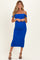 woman wearing a blue off-shoulder ruched maternity dress and showcasing her baby bump