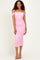 woman wearing a pink off-the-shoulder bodycon dress with ruched detailing and a midi length
