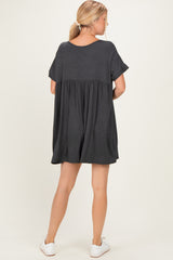 woman wearing a charcoal gray short sleeve swing dress with a gathered waist and back view