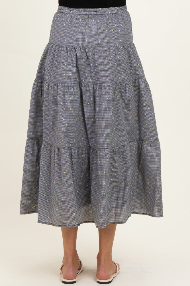 maternity wear blue and white striped tiered maxi skirt worn by a woman, showing the back view