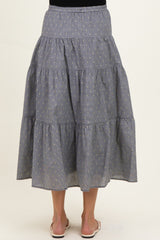 maternity wear blue and white striped tiered maxi skirt worn by a woman, showing the back view