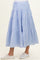 maternity wear light blue tiered maxi skirt with red dot pattern, worn with white sneakers