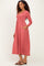 woman wearing a dusty rose long sleeve ribbed maxi dress with pockets and a v-neckline
