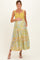 woman wearing a yellow and blue floral maternity maxi dress with a baby bump and pockets