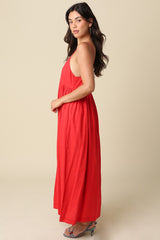 woman wearing a red sleeveless maxi dress with a flowing silhouette and a relaxed fit