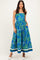 woman wearing a blue floral maxi dress with a strapless design and pockets
