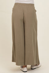 woman wearing a pair of beige wide-leg maternity pants, view from the back