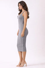 woman wearing a fitted gray ribbed midi dress with spaghetti straps and a bodycon silhouette