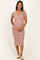 woman wearing a striped maternity dress with short sleeves and a keyhole neckline, showcasing her baby bump