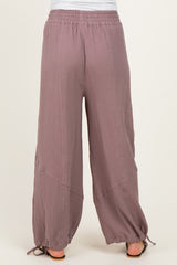 woman wearing mauve maternity wide-leg pants with an elastic waistband and drawstring hem