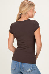 woman wearing a fitted dark brown ribbed t-shirt with short sleeves, viewed from the back with jeans