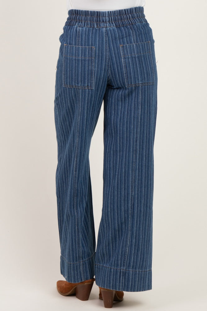 woman wearing maternity striped denim wide-leg pants, showing the back view with elastic waistband and two back pockets