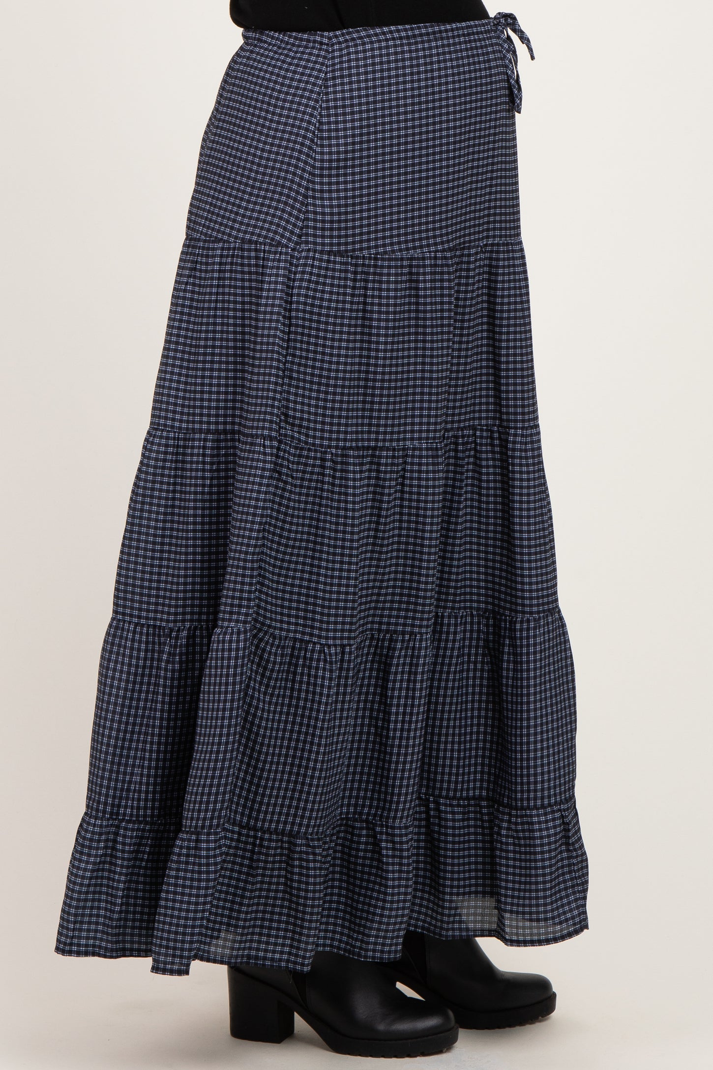 maternity wear navy blue gingham tiered maxi skirt with adjustable tie detail worn by a model