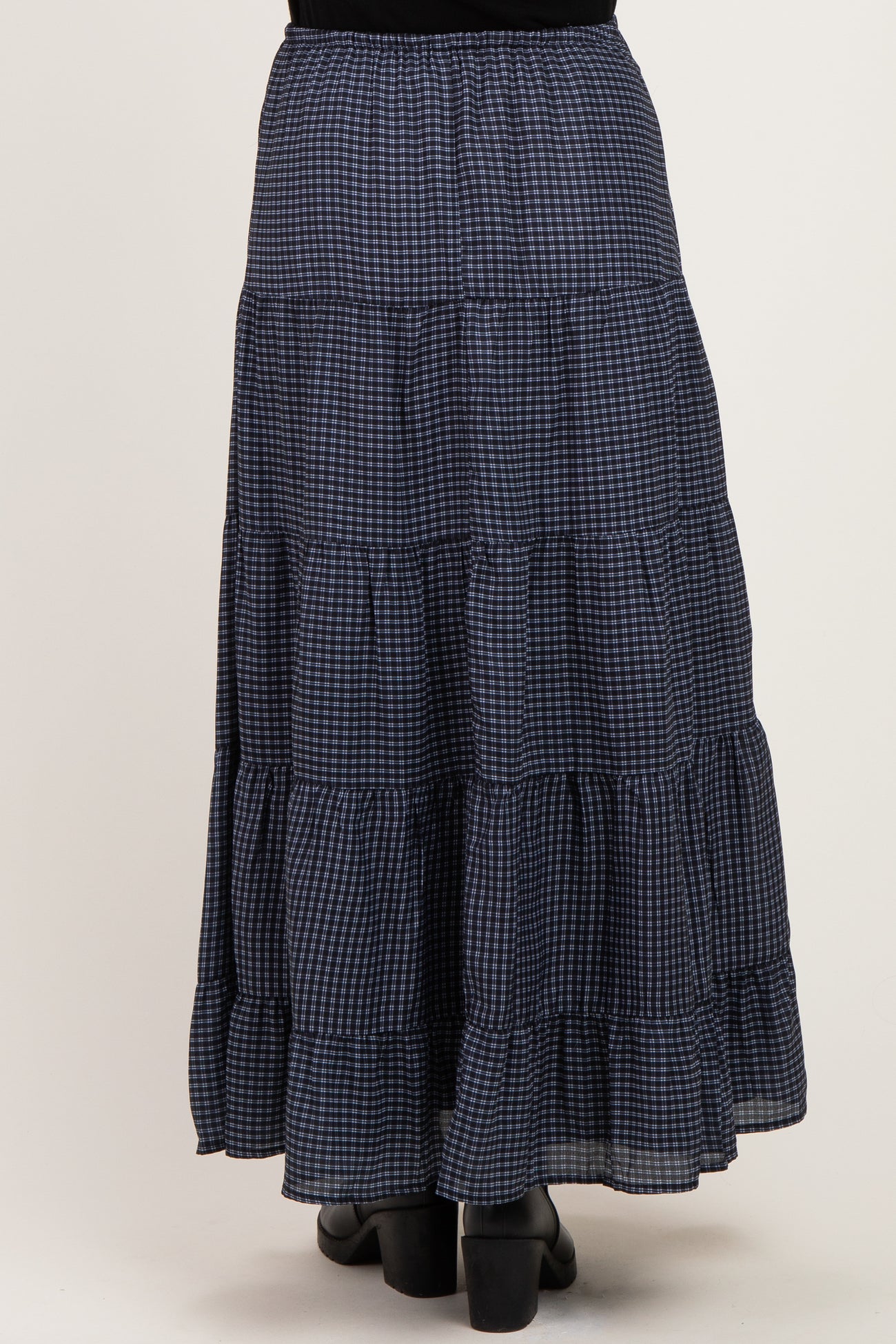 maternity wear navy blue gingham tiered maxi skirt with a ruffled hem, shown from the back