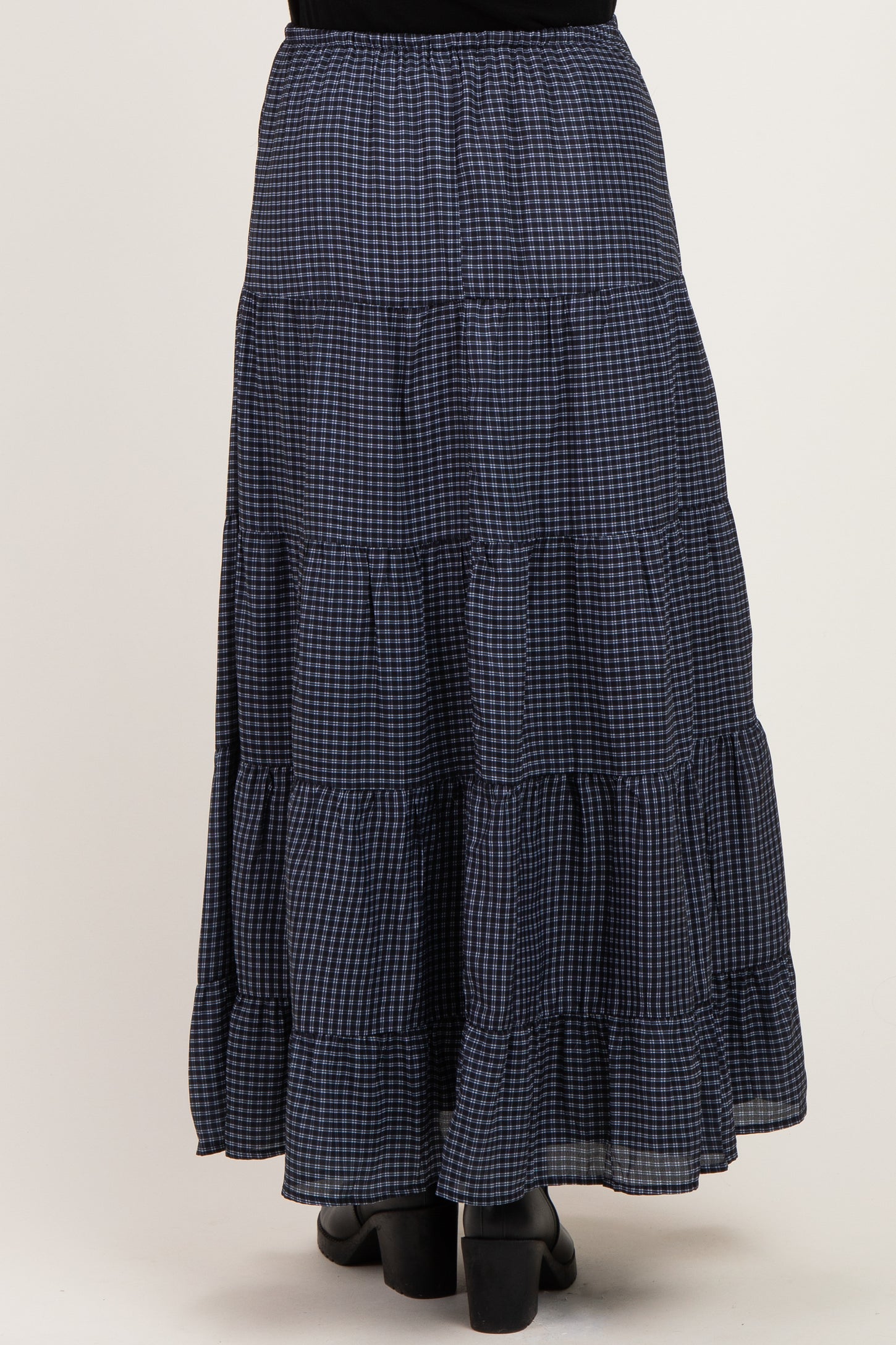 maternity wear navy blue gingham tiered maxi skirt with a ruffled hem, shown from the back
