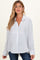 woman wearing a white and blue striped maternity shirt with a button-down front and relaxed fit