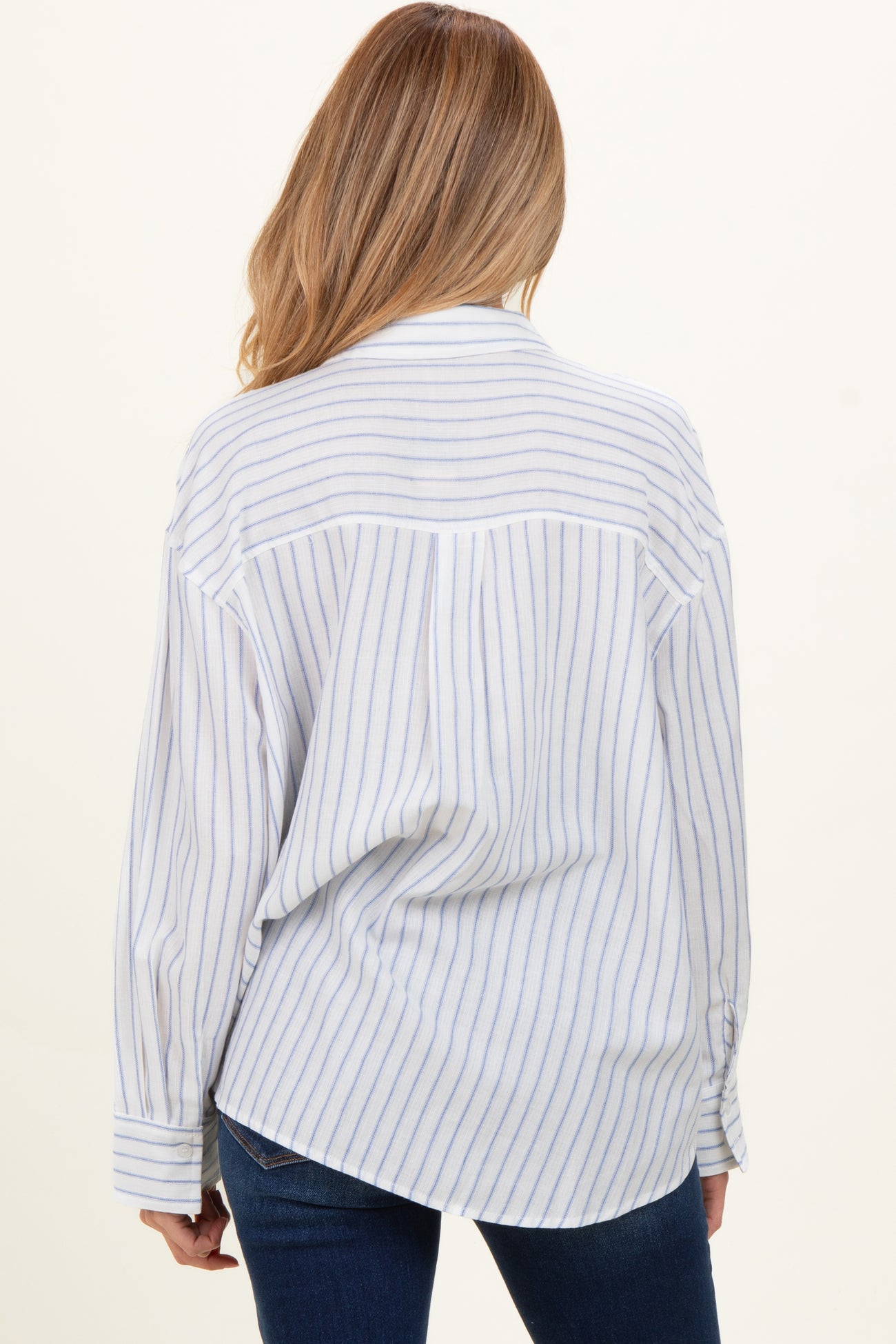 light blue and white striped maternity shirt with long sleeves, shown from the back