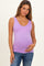 woman wearing a lilac maternity tank top and holding her baby bump