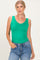 woman wearing a bright green sleeveless bodysuit with a scoop neckline and high-waisted jeans
