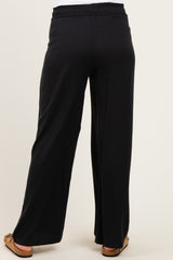 black maternity wide leg pants with an elastic waistband, shown from the back